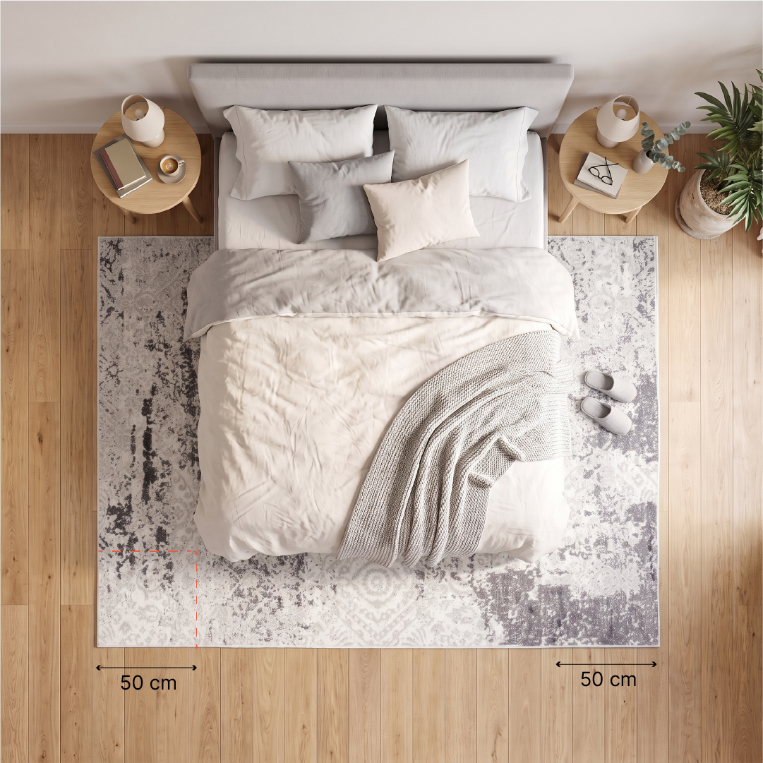 rzut z góry (schemat lub aranżacja) - łóżko 160x200 na dywanie 250x350; zaznaczone wymiarowanie: 50–60 cm zapasu dywanu po bokach i przy nogach łóżka